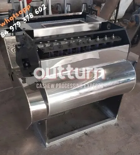 OUTTURN 10-head cashew nut cutting machine with ten rotary cutting cups on a steel frame